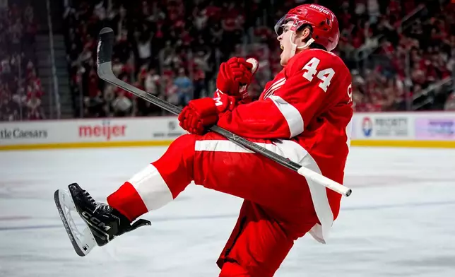 Detroit Red Wings defenseman Axel Sandin-Pellikka celebrates after scoring a goal during the second period of an NHL hockey game against the Vancouver Canucks Thursday, Jan. 8, 2026, in Detroit. (AP Photo/Ryan Sun)