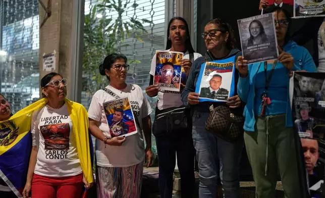 Relatives of detainees gather the near El Helicoide, headquarters of Venezuela's intelligence service and a detention center, in Caracas, Venezuela, Friday, Jan. 30, 2026, on the same day acting President Delcy Rodríguez announced an amnesty bill that could lead to the release of hundreds of prisoners, including opposition leaders, journalists and human rights activists detained for political reasons. (AP Photo/Ariana Cubillos)