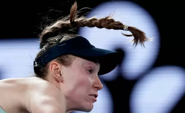 Elena Rybakina of Kazakhstan serves to Jessica Pegula of the U.S. during their semifinal match at the Australian Open tennis championship in Melbourne, Australia, Thursday, Jan. 29, 2026. (AP Photo/Aaron Favila)