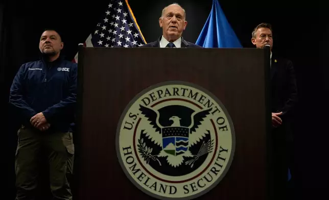 White House border czar Tom Homan holds a news conference as Marcos Charles and Rodney Scott, listen, at the Bishop Whipple Federal building on Thursday, Jan. 29, 2026 in Minneapolis. (AP Photo/Julia Demaree Nikhinson)