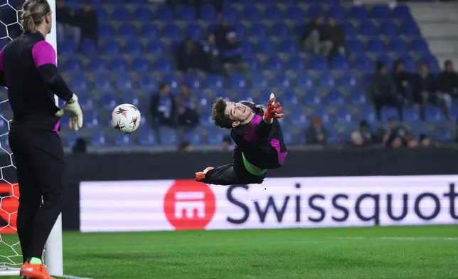 Malmo's goalkeeper Melker Ellborg warms up during the Europa League opening phase soccer match between Genk and Malmo in Genk, Belgium, Thursday, Jan. 29, 2026. (AP Photo/Omar Havana)
