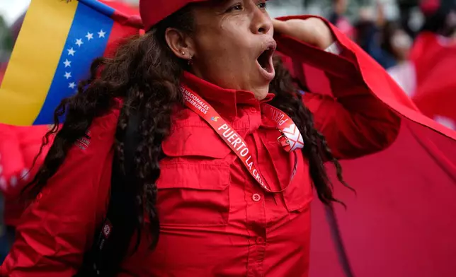 Workers of Venezuela's state-owned PDVSA oil company rally to back an oil reform bill proposed by acting President Delcy Rodriguez to loosen state control and open the industry to private and foreign investment in Caracas, Venezuela, Thursday, Jan. 29, 2026. (AP Photo/Ariana Cubillos)