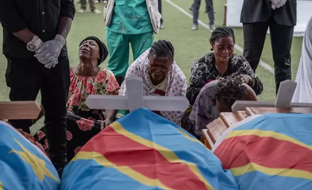 The families of victims mourn at the funeral service for civilians killed in a drone strike in Goma, Democratic Republic of Congo, Thursday, Jan. 8, 2026. (AP Photo/Moses Sawasawa)