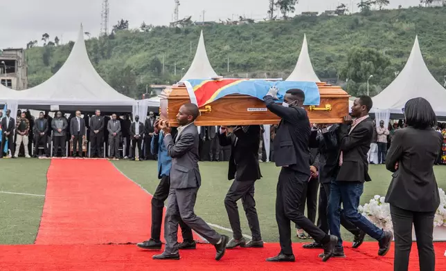 People carry the coffin of a victim of a drone strike in Goma, Democratic Republic of Congo, Thursday Jan. 8, 2026. (AP Photo/Moses Sawasawa)