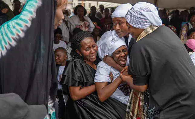 The families of victims mourn at the funeral service for civilians killed in a drone strike in Goma, Democratic Republic of Congo, Thursday, Jan. 8, 2026. (AP Photo/Moses Sawasawa)