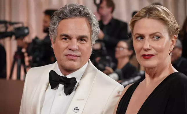 Mark Ruffalo, left, and Sunrise Coigney arrive at the 83rd Golden Globes on Sunday, Jan. 11, 2026, at the Beverly Hilton in Beverly Hills, Calif. (Photo by Jordan Strauss/Invision/AP)