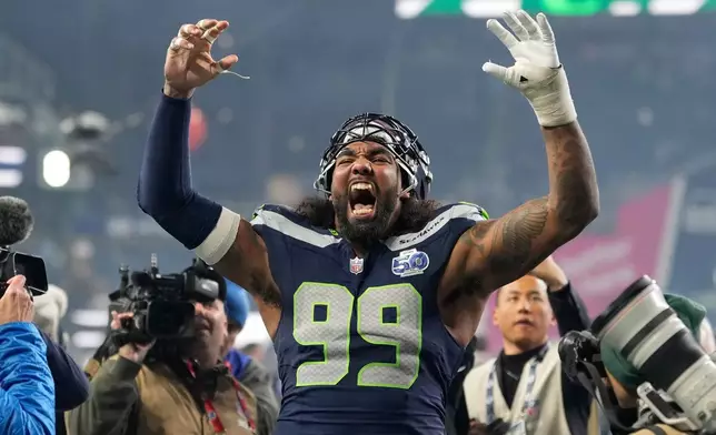 Seattle Seahawks defensive tackle Leonard Williams (99) reacts after NFL football divisional playoff game against the San Francisco 49ers, Saturday, Jan. 17, 2026, in Seattle. (AP Photo/Stephen Brashear)