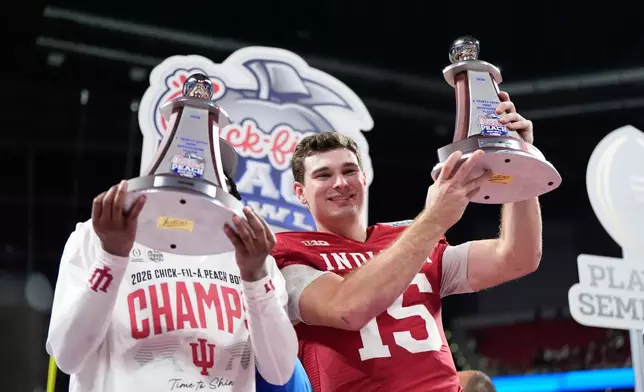 Indiana quarterback Fernando Mendoza (15) celebrates after the Peach Bowl NCAA college football playoff semifinal against Oregon, Friday, Jan. 9, 2026, in Atlanta. (AP Photo/Brynn Anderson)