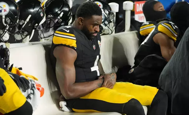 Pittsburgh Steelers wide receiver Dk Metcalf sits on the bench during the second half of an NFL wild-card playoff football game against the Houston Texans, Monday, Jan. 12, 2026, in Pittsburgh. (AP Photo/Gene J. Puskar)