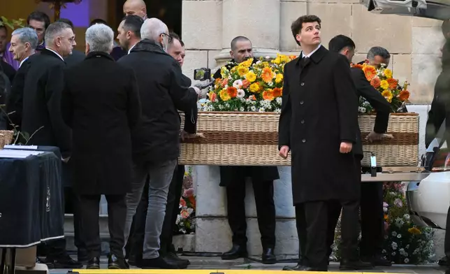 Actor Brigitte Bardot's coffin is carried outside Notre-Dame de l'Assomption church for her funeral ceremony, Wednesday, Jan. 7, 2026 in Saint-Tropez, southern France. (AP Photo/Philippe Magoni)