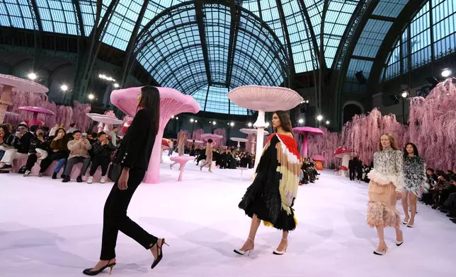 Models wear creations as part of the Chanel Spring/Summer 2026 Haute Couture collection presented in Paris, Tuesday, Jan. 27, 2026. (AP Photo/Aurelien Morissard)