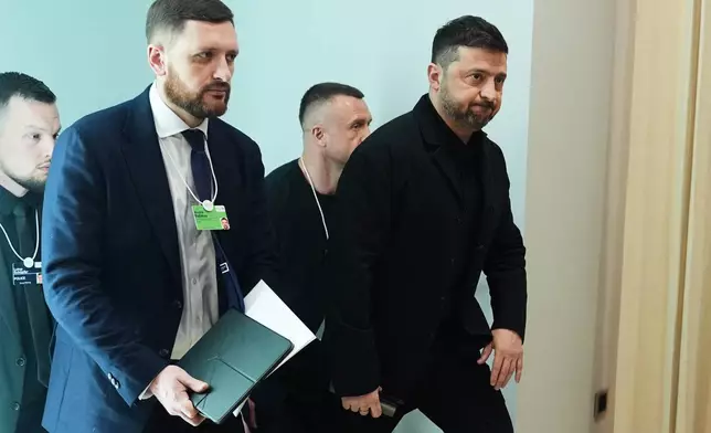 Ukraine's President Volodymyr Zelenskyy arrives for a meeting on the sidelines of the Annual Meeting of the World Economic Forum in Davos, Switzerland, Thursday, Jan. 22, 2026. (AP Photo/Evan Vucci)