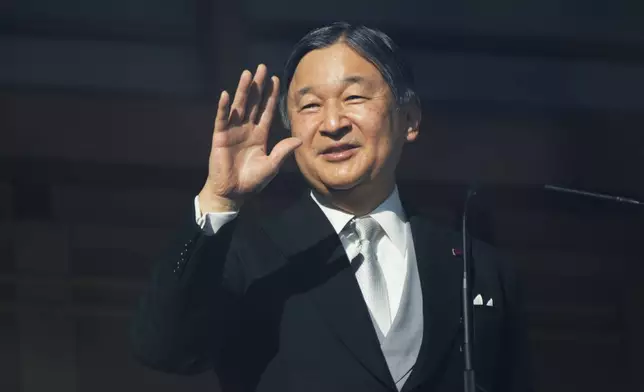 Japan's Emperor Naruhito greets well-wishers during a public appearance for New Year's celebrations at the Imperial Palace in Tokyo, Friday, Jan. 2, 2026. (AP Photo/Eugene Hoshiko)