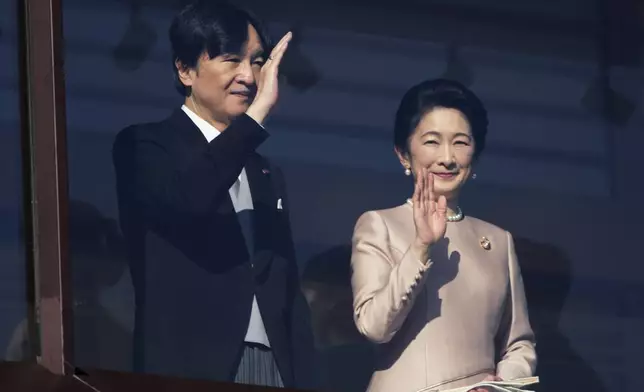 Japan's Crown Prince Akishino and Crown Princess Kiko greet well-wishers during a public appearance for New Year's celebrations at the Imperial Palace in Tokyo, Friday, Jan. 2, 2026. (AP Photo/Eugene Hoshiko)