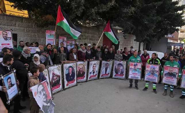 Family members of Palestinian prisoners held in Israeli jails and medical staff take part in a protest organized by the Palestinian Prisoners Committee calling for their release outside the Red Cross headquarters in Gaza City Monday, Jan. 12, 2026. (AP Photo/Jehad Alshrafi)