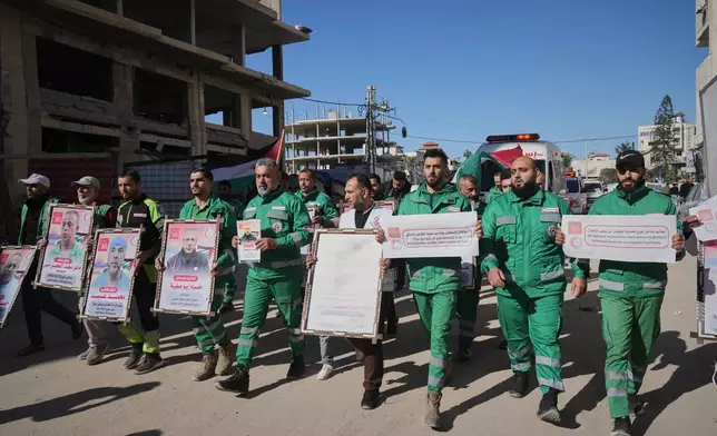 Medical staff take part in a protest organized by the Palestinian Prisoners Committee calling for the release of prisoners held in Israeli prisons outside the Red Cross headquarters in Gaza City Monday, Jan. 12, 2026. (AP Photo/Jehad Alshrafi)