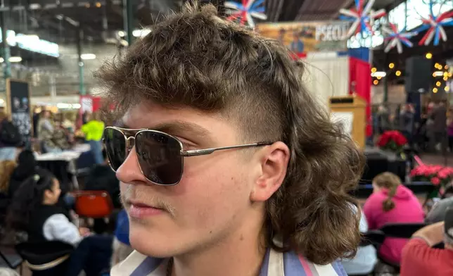 Austyn Whirt, 18, prepares for a mullet hairstyle contest, Monday, Jan. 12, 2026 in Harrisburg, Pa. (AP Photo/Tassanee Vejpongsa)