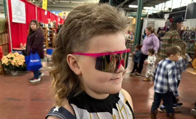 Mikey "The Mullet" Nelson, an 8-year old-contestant in a mullet hairstyle contest, gets ready for competition, Monday, Jan. 12, 2026 in Harrisburg, Pa. (AP Photo/Tassanee Vejpongsa)