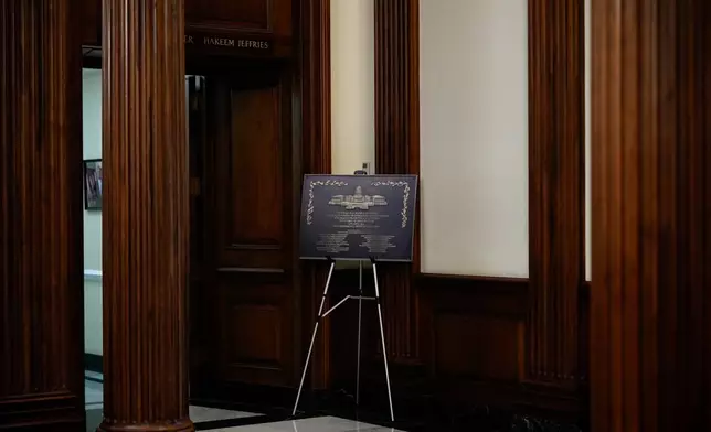 A replica plaque commemorating the Jan. 6, 2021 Capitol riot stands outside the office of House Minority Leader Hakeem Jeffries, D-N.Y, Tuesday, Dec. 30, 2025, at the U.S. Capitol in Washington. (AP Photo/Julia Demaree Nikhinson)