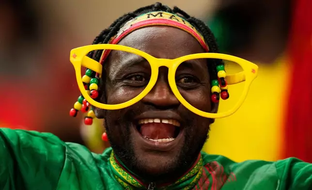 FILE - A Mali soccer fan waits for the start of the African Cup of Nations Group A soccer match with Morocco in Rabat, Dec. 26, 2025. (AP Photo/Mosa'ab Elshamy, File)