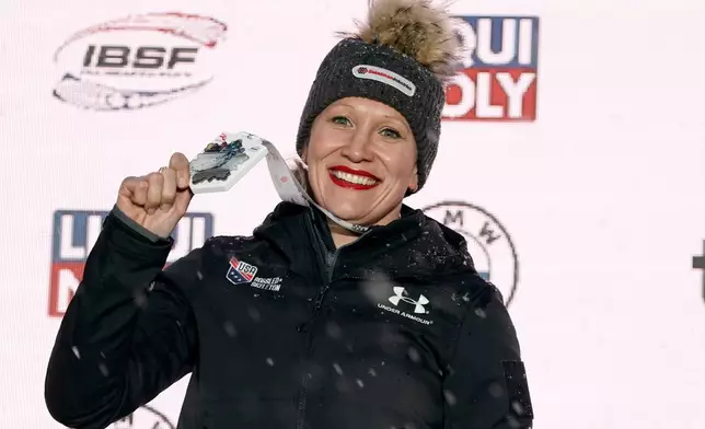 FILE - First placed Kaillie Humphries of United States celebrates during award ceremony of the of the Women's Monobob World Cup race in Sigulda, Latvia, Saturday, Feb. 18, 2023. (AP Photo/Oksana Dzadan, FILE)
