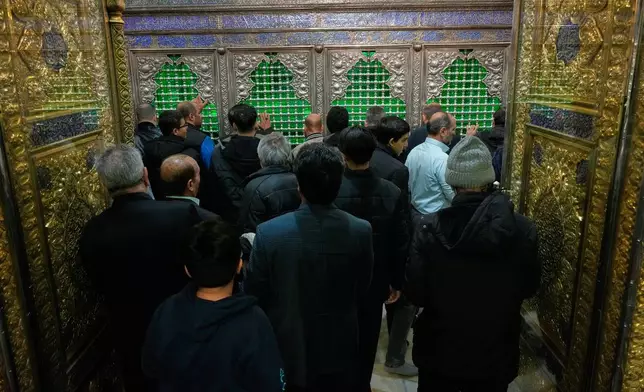 People pray at the Saint Abdulazim shrine in Shahr-e-Ray, south of Tehran, Iran, Thursday, Jan. 29, 2026. (AP Photo/Vahid Salemi)