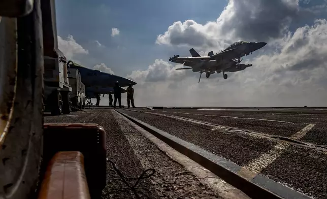 This handout image from the U.S. Navy shows an EA-18G Growler landing on the flight deck of the Nimitz-class aircraft carrier USS Abraham Lincoln in the Indian Ocean on Jan. 23, 2026. (Mass Communication Specialist Seaman Daniel Kimmelman/U.S. Navy via AP)