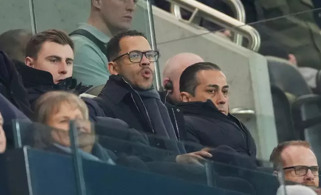 Chelsea's head coach Liam Rosenior, centre, and Chelsea co-owner Behdad Eghbali, right, watch the English Premier League soccer match between Fulham and Chelsea in London, Wednesday, Jan. 7, 2026. (AP Photo/Dave Shopland)
