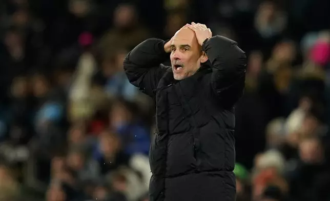 Manchester City head coach Pep Guardiola reacts after Erling Haaland missed a scoring opportunity during the English Premier League soccer match between Manchester City and Brighton and Hove Albion in Manchester, England, Wednesday, Jan. 7, 2026. (AP Photo/Dave Thompson)