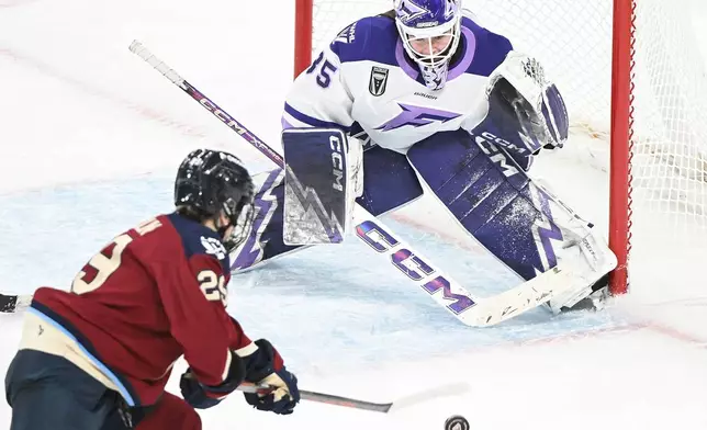 Montreal Victoire's Marie-Philip Poulin (29) moves in to score on Minnesota Frost goaltender Maddie Rooney during overtime in a PWHL hockey game in Laval, Quebec, Sunday, Jan. 4, 2026. (Graham Hughes/The Canadian Press via AP)