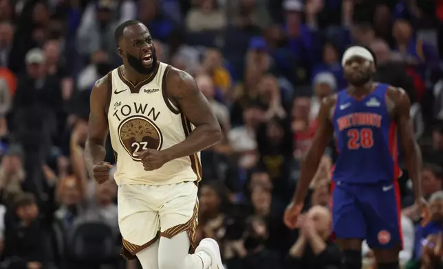 Golden State Warriors forward Draymond Green (23) reacts after scoring during the first half of an NBA basketball game against the Detroit Pistons in San Francisco, Friday, Jan. 30, 2026. (AP Photo/Jed Jacobsohn)