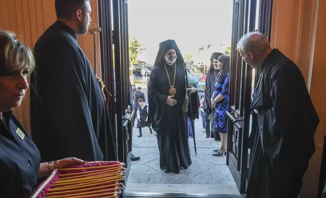His Eminence Archbishop Elpidophoros of the Greek Orthodox Archdiocese of America as is welcomed into the Saint Nicholas Greek Orthodox Cathedral during the 120th Epiphany celebration on Tuesday, Jan 6, 2026, in Tarpon Springs, Fla. (Jefferee Woo /Tampa Bay Times via AP)
