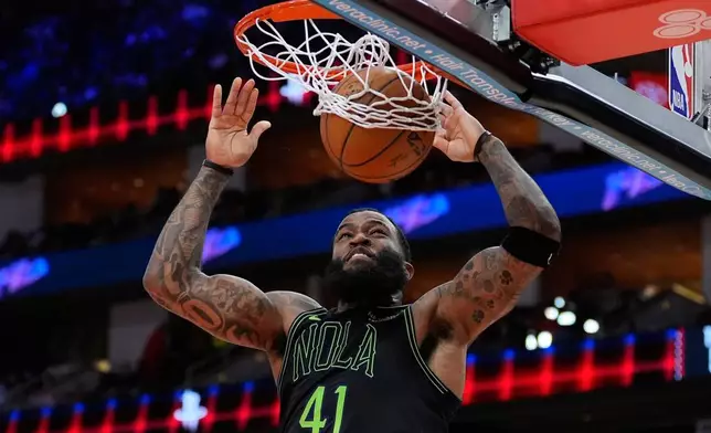 New Orleans Pelicans guard Saddiq Bey dunks during the first half of an NBA basketball game against the Houston Rockets in Houston, Sunday, Jan. 18, 2026. (AP Photo/Ashley Landis)
