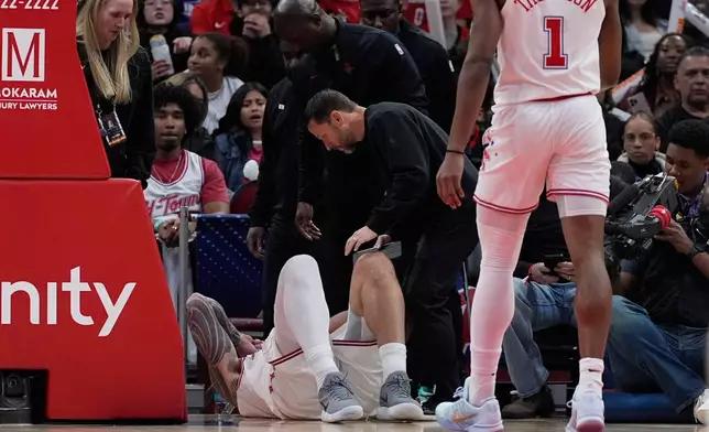 Houston Rockets center Steven Adams is checked out for injury during the second half of an NBA basketball game against the New Orleans Pelicans in Houston, Sunday, Jan. 18, 2026. (AP Photo/Ashley Landis)