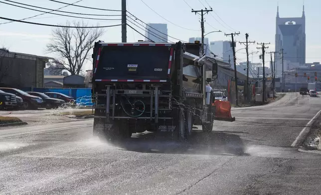 A Nashville Department of Transportation truck applies salt brine to a roadway Thursday, Jan. 22, 2026, in Nashville, Tenn. ahead of a winter storm expected to hit the state over the weekend. (AP Photo/George Walker IV)
