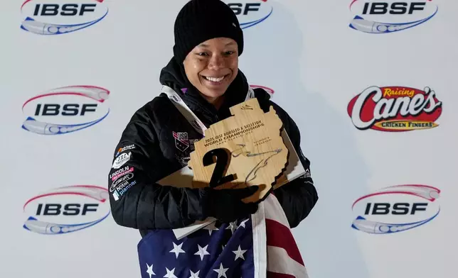 FILE - Mystique Ro, of the United States, poses with her second place trophy during the medal ceremony at the skeleton world championships, Friday, March 7, 2025, in Lake Placid, N.Y. (AP Photo/Julia Demaree Nikhinson, File)