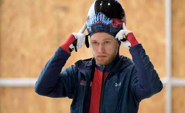 FILE - Austin Florian, of The United States, prepares for the start of a training run for the men's World Cup Skeleton event in Lake Placid, N.Y., on Friday, Dec. 6, 2019. Competition begins on Saturday. (AP Photo/Hans Pennink, File)