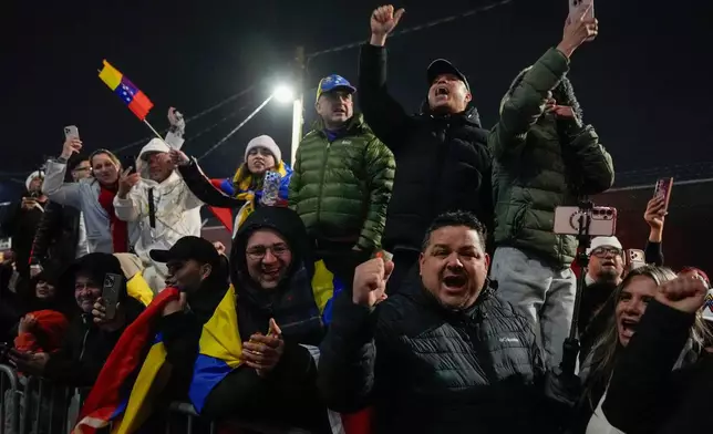 Demonstrators celebrate the arrival of captured Venezuelan President Nicolas Maduro at the Metropolitan Detention Center, Saturday, Jan. 3, 2026, in New York. (AP Photo/Yuki Iwamura)
