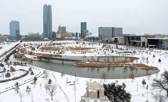 An aerial view of snowfall in downtown Oklahoma City on Saturday, Jan. 24, 2026. (AP Photo/Alonzo Adams)