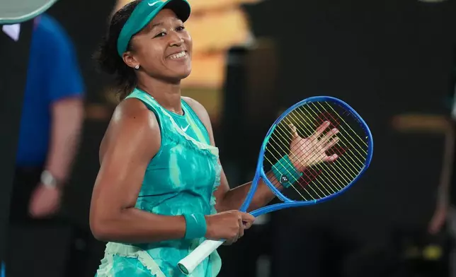 Naomi Osaka of Japan reacts after defeating Antonia Ruzic of Croatia in her first round match at the Australian Open tennis championship in Melbourne, Australia, Tuesday, Jan. 20, 2026. (AP Photo/Asanka Brendon Ratnayake)
