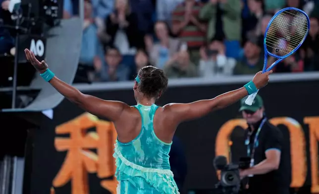 Naomi Osaka of Japan reacts after defeating Sorana Cirstea of Romania in their second round match at the Australian Open tennis championship in Melbourne, Australia, Thursday, Jan. 22, 2026. (AP Photo/Dita Alangkara)