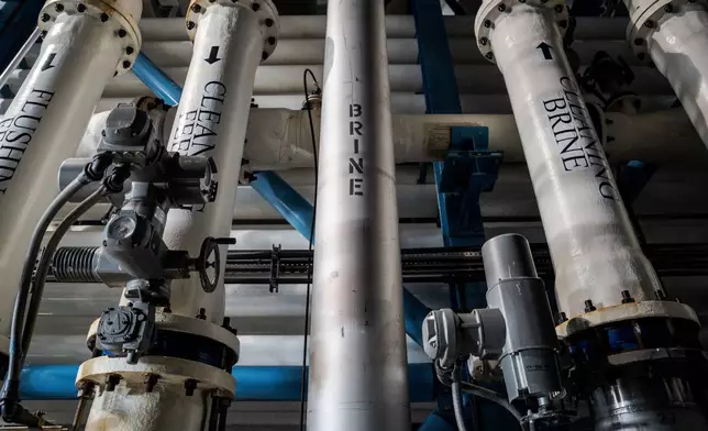 Pipes carrying brine and other substances run through the Carlsbad desalination plant in Carlsbad, Calif., Tuesday, Dec. 2, 2025. (AP Photo/Annika Hammerschlag)
