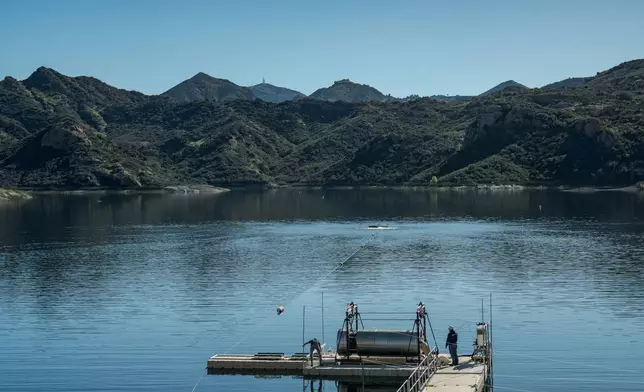 A prototype OceanWell reverse osmosis pod sits on the dock at the Las Virgenes Reservoir in Westlake Village, Calif., Monday, Dec. 1, 2025, where the deep sea desalination technology is being tested. (AP Photo/Annika Hammerschlag)