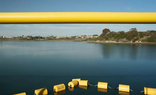 A sectioned-off area of the Agua Hedionda Lagoon marks the seawater intake for the Carlsbad desalination plant in Carlsbad, Calif., Tuesday, Dec. 2, 2025. (AP Photo/Annika Hammerschlag)