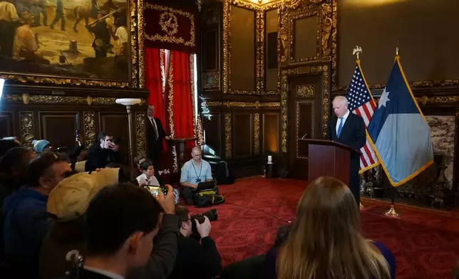 Minnesota Gov. Tim Walz holds a news conference at the Minnesota State Capitol on Monday, Jan. 5, 2026, in St. Paul, Minn. (AP Photo/Giovanna Dell'Orto)