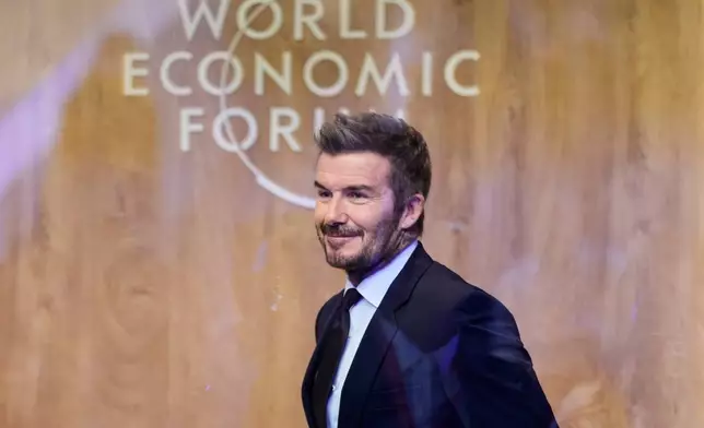Former soccer player David Beckham leaves after a podcast during of the Annual Meeting of the World Economic Forum in Davos, Switzerland, Tuesday, Jan. 20, 2026. (AP Photo/Markus Schreiber)