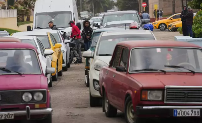 Drivers wait in line to fill up at a gas station in Havana, Cuba, Tuesday, Jan. 27, 2026. (AP Photo/Ramon Espinosa)