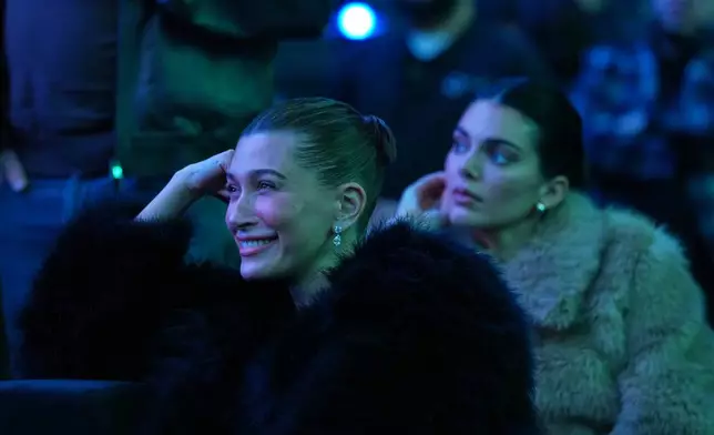 Haylie Bieber, left, and Kendall Jenner watch stage remarks at the launch party for Fanatics Studio, a global studio for sports entertainment, on Tuesday, Jan. 13, 2026, at the Intuit Dome in Inglewood, Calif. (AP Photo/Chris Pizzello)