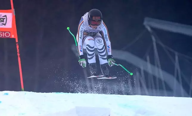 Germany's Kira Weidle Winkelmann speeds down the course during an alpine ski, women's World Cup downhill, in Tarvisio, Italy, Saturday, Jan. 17, 2026. (AP Photo/Giovanni Auletta)