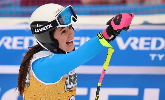 Italy's Nadia Delago celebrates at the finish area of an alpine ski, women's World Cup downhill, in Tarvisio, Italy, Saturday, Jan. 17, 2026. (AP Photo/Marco Trovati)